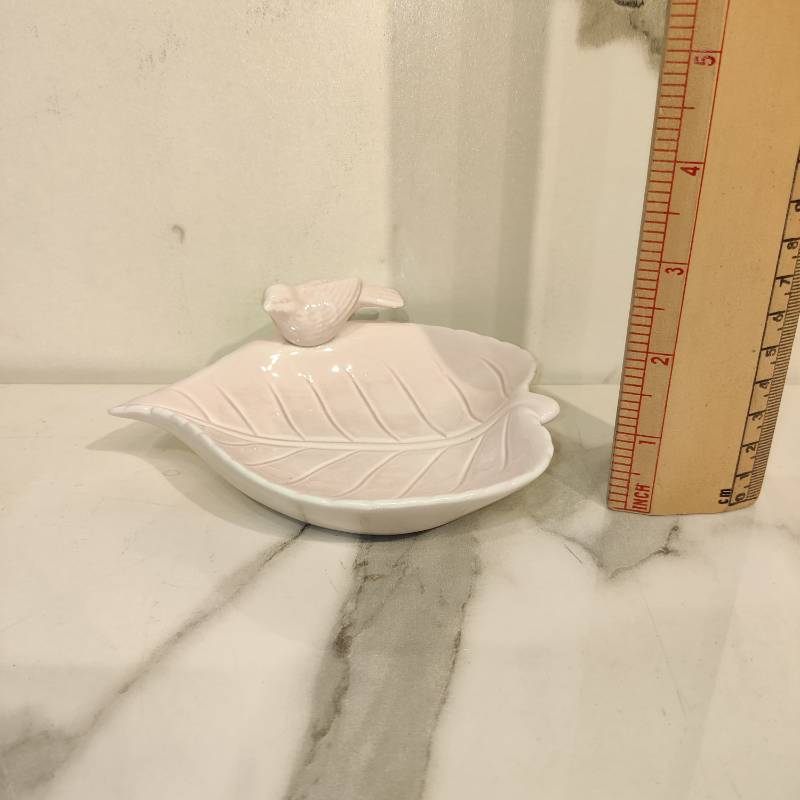 Ceramic leaf tray with a perching bird